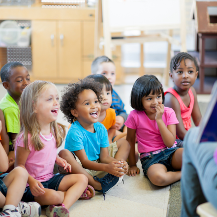 children feels lively and vibrant in a group activitys with the teacher