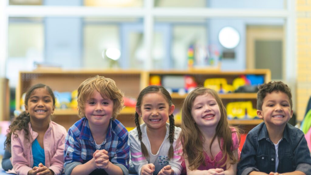 Children begin the first day of class with a smile