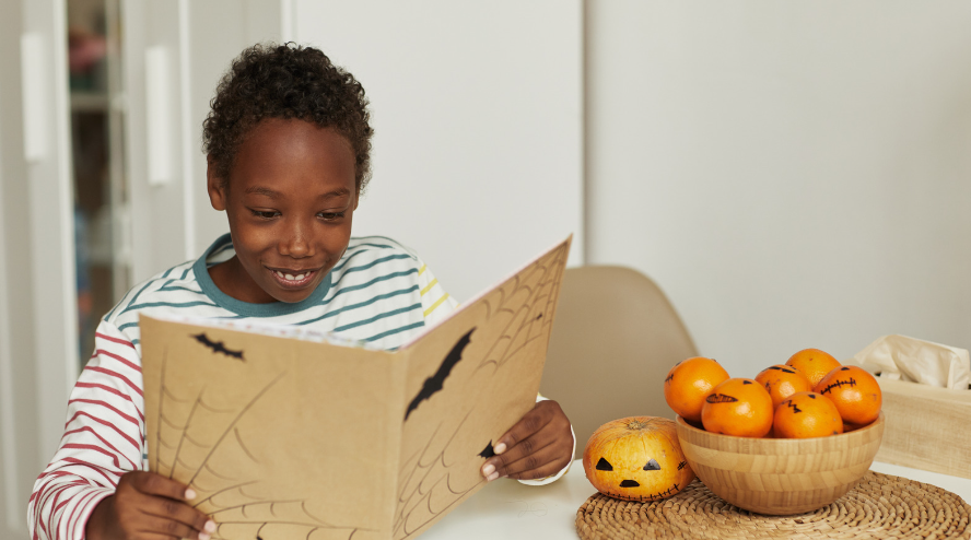 kid-reading-halloween-book